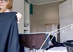 Sexually excited blond arranges her raiment with the window open and the neighbour outside sees her nude