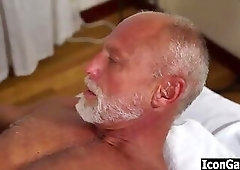 Old gay man puts on cock rings before having massage