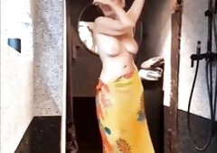 Charming blond older wife Selena presents her spontaneous half nude dancing posing and reverse footjob with cum on her feet, legs and back
