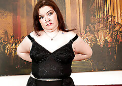 Bushy mature playing with her dildo