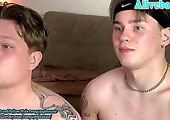 two guys with tattoos have pleasure on webcam