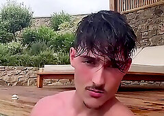 Levy jerks off in the pool.