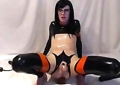 Sissy in chastity bouncing on dildo