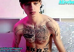 skinny European boy with piercings and full tattoos wanks until he cums a lots