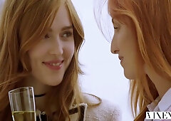 Two redheads reunite on vacation and welcome her partner for a steamy threesome