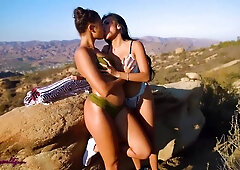 Sensual Asian vixen entices ebony teen in a captivating scene