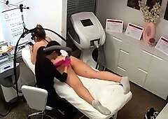 Hidden cam captures laser hair removal session on teen pussy