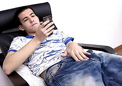 Sexy naked twink Xander enjoys a leisurely masturbation session in the living room