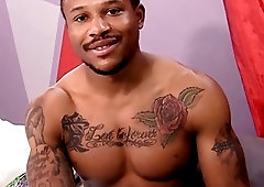 Ripped black guy pulls on his man stick