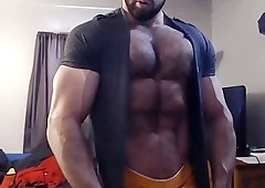 Hunk with muscles flexes his amazing body