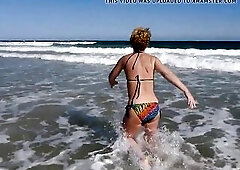 Mother I'd Like To Fuck Mary in her skimpy bikini plays on the beach whilst hubby films!