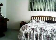 Here is my wife preparing herself for some afternoon delight on hidden web camera.