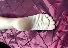 Mature Portuguese woman showcases her bare feet on a mountain rock and in bed