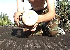 Drinking sperm from rubber pussy on the roof