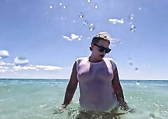 Emma swims in the ocean wearing no thing but a soaking soaked white t-shirt that's turned absolutely watch-throughout. Underwater this babe plays