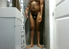 Indian Guy Enjoying Himself With An Oil Shower