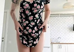 Sexually excited angel tries on a short costume, takes off her pants, and shows her cunt