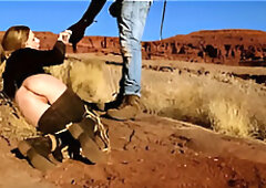 Big-butt blonde gets her anus whipped, then gets rough anal sex in dirt and piss -- a real BDSM session outdoors in the Western USA with Rebel Rhyder