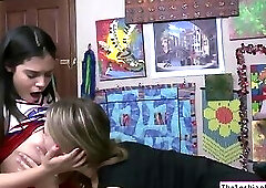Lesbian teen scissoring with cheerleader