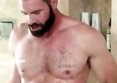 Breasty black masseuse sucking in shower