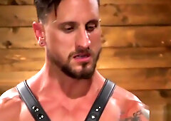 Gagging BDSM stud gets whipped by gay dom