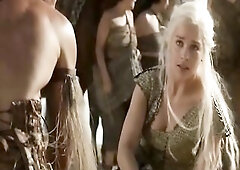 Sibel Kekilli shrugging her dress off her shoulders to go topless as a guy looks on. We see her bare breasts as she hikes up her skirt and then climbs