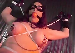 Catwoman is a large titted brunette hair who loves to get bound up and compulsory to cum