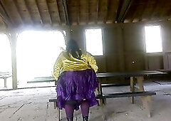 Molly is Dancing in the park during the time that playing party music showing her booty. This Babe bows over and her green silk pants are stripped to 