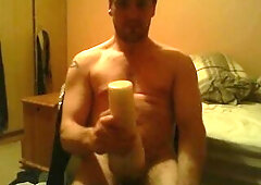 Sitting on chair watching porn banging a felsh light untill I ejaculate