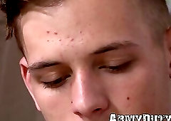 Inked pale dude lays down on the bed and strokes his meat