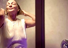 Granny Sydni Lane, 73 years young, showers in a white t-shirt
