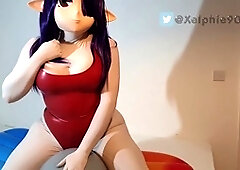 Xelphie rides a grey balloon in various kinky outfits, including a kigurumi and a sexy one-piece swimsuit