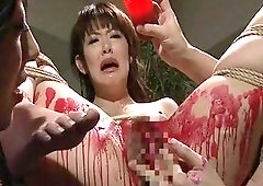 Attractive Asian screams in bondage while being tortured with a candle
