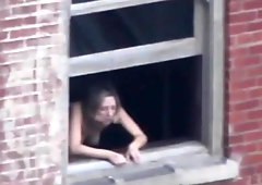 Lusty chick has a thing for getting ravaged at the window, in the middle of the day