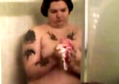 Obese hottie gets soaked and soapy in shower