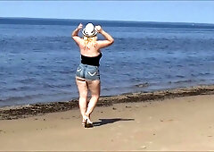 Large booties in jeans shorts , summer beach sexy