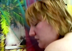 Mature Czech granny with big natural tits rides hard on an orange couch