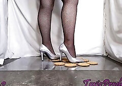 Crunchy crackers beneath her pleasing fresh silver pumps