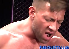 Brawny hunks in threeway spitroast