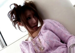 Using a pink dildo to get off on her hairy muff