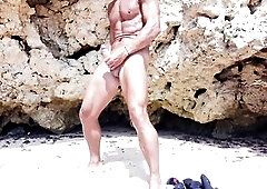 Hot stud walks in nature's garb on the beach and touches his shlong in a risky way - tiny spunk flow