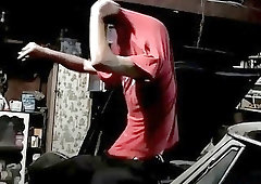 Hiding out in the garage, this slender babe works his cock with a sure hand