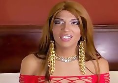 Latina tranny in red fishnet solo jerking