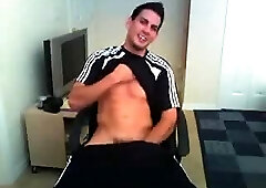 Soccer boy plays with his cock and balls