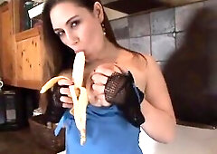 Stud titty bangs and gets BJ in kitchen. Food and foot fetish, nylon fetish. Large boobed gal in underware and with the fishnet gloved hands is doing 